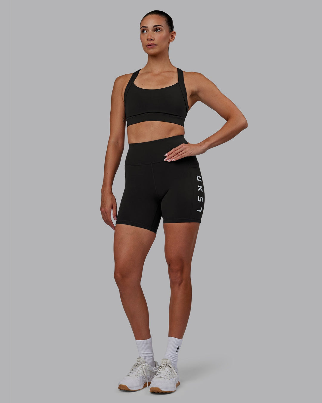 Woman wearing Rep Mid-Length Shorts - Pirate Black-White