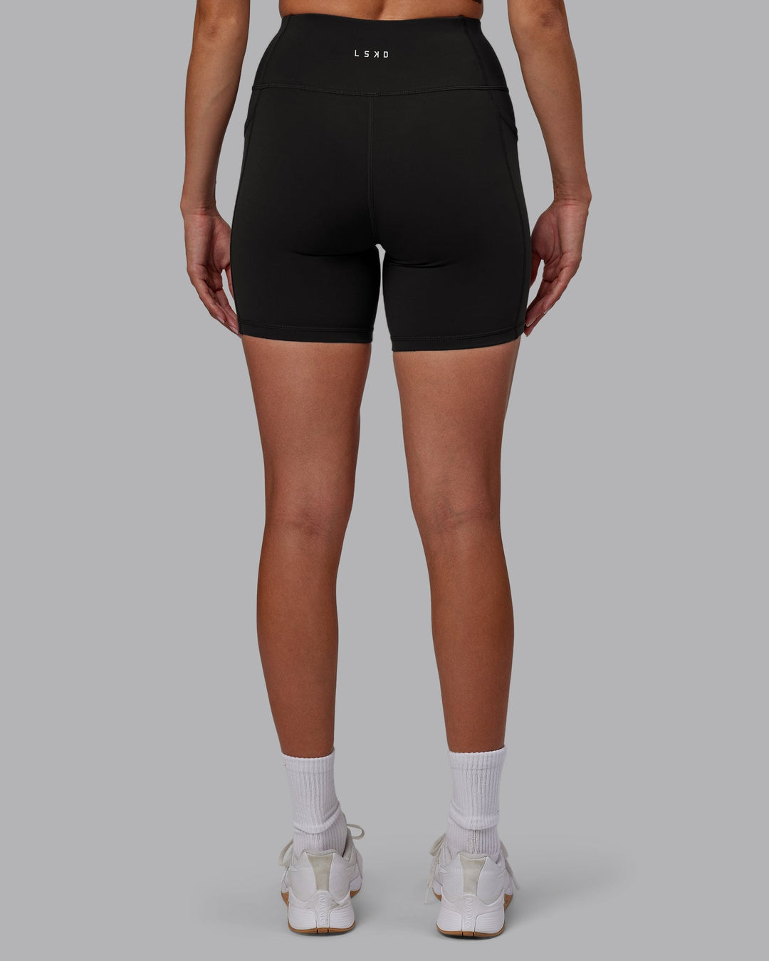 Woman wearing Rep Mid-Length Shorts - Pirate Black-White