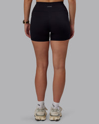 Woman wearing Rep Ultra High-Rise 4" Short Pockets - Black-Black