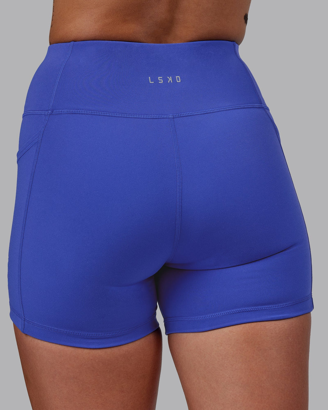 Woman wearing Rep X-Length Shorts - Power Cobalt-White