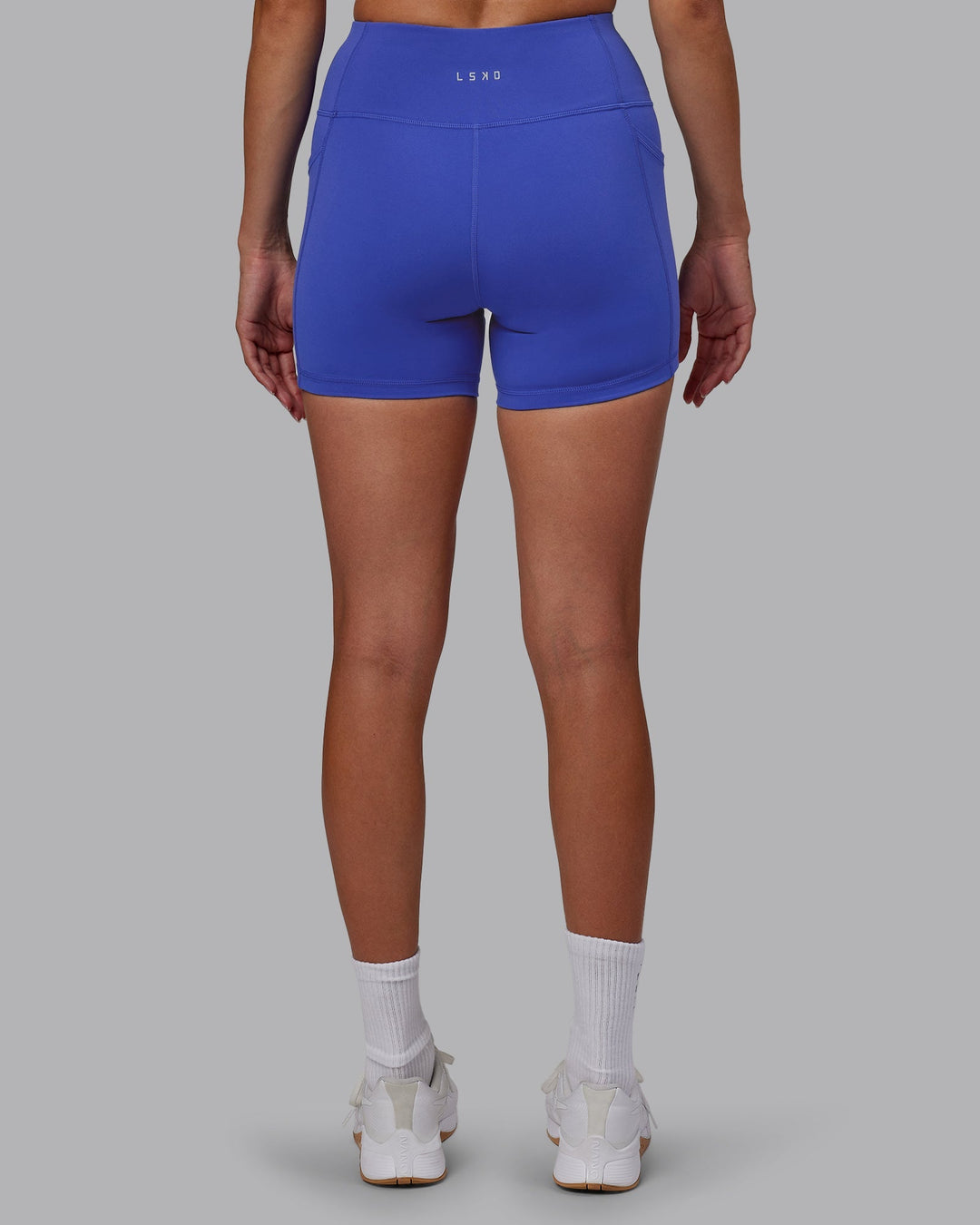 Woman wearing Rep X-Length Shorts - Power Cobalt-White