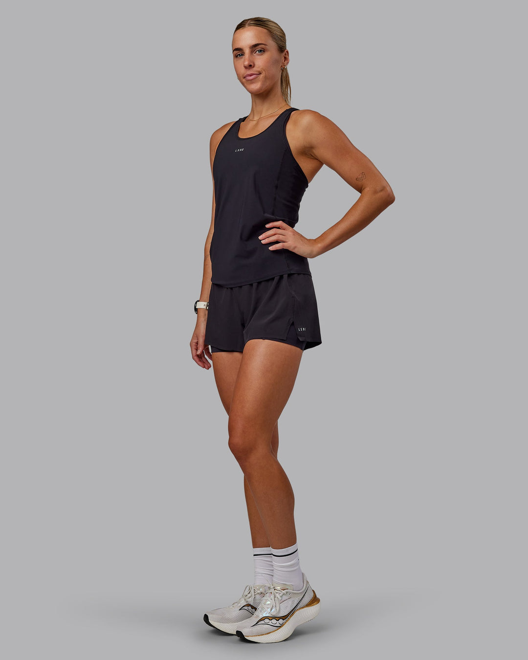 Woman wearing Rush Performance Tank - Black