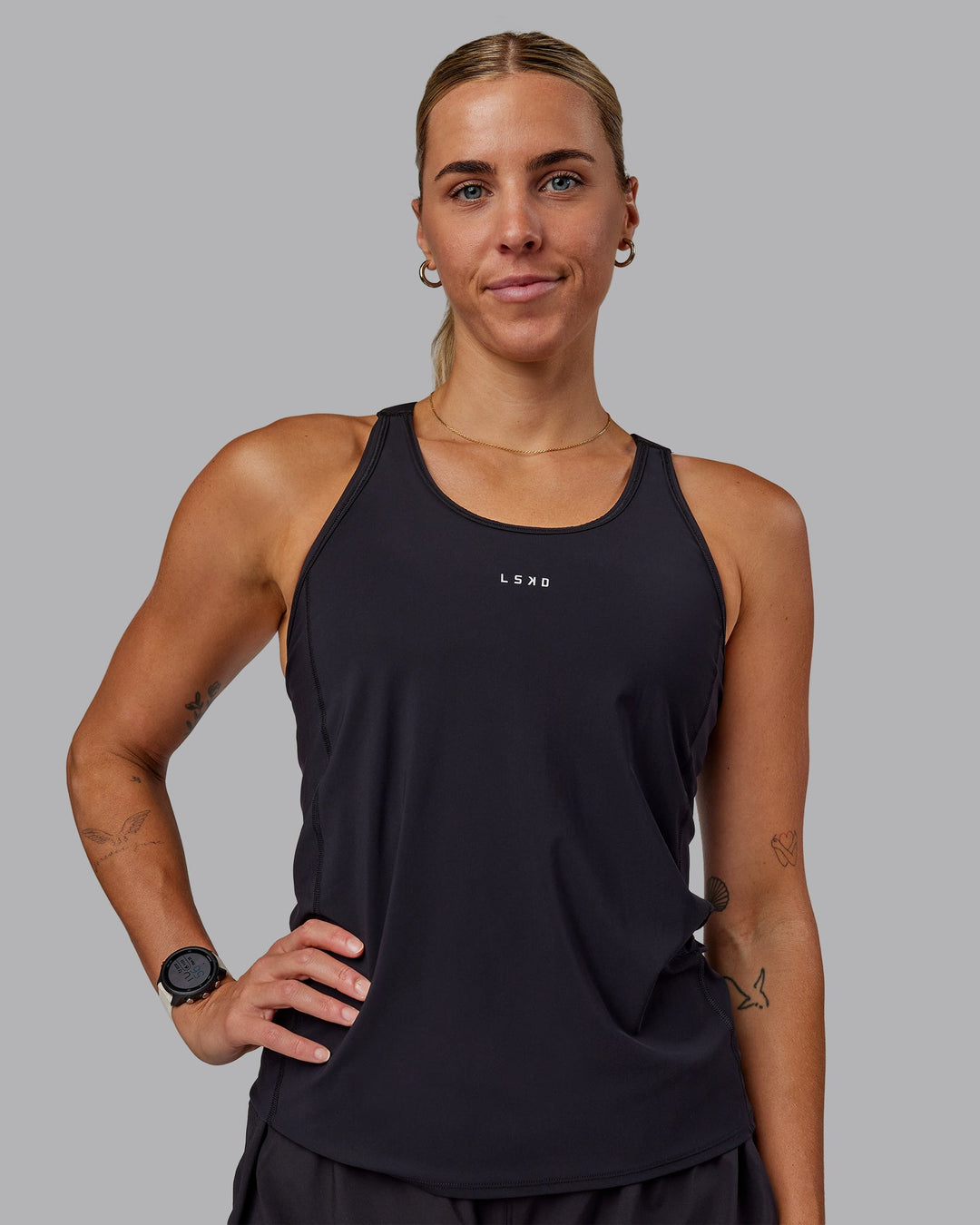 Woman wearing Rush Performance Tank - Black