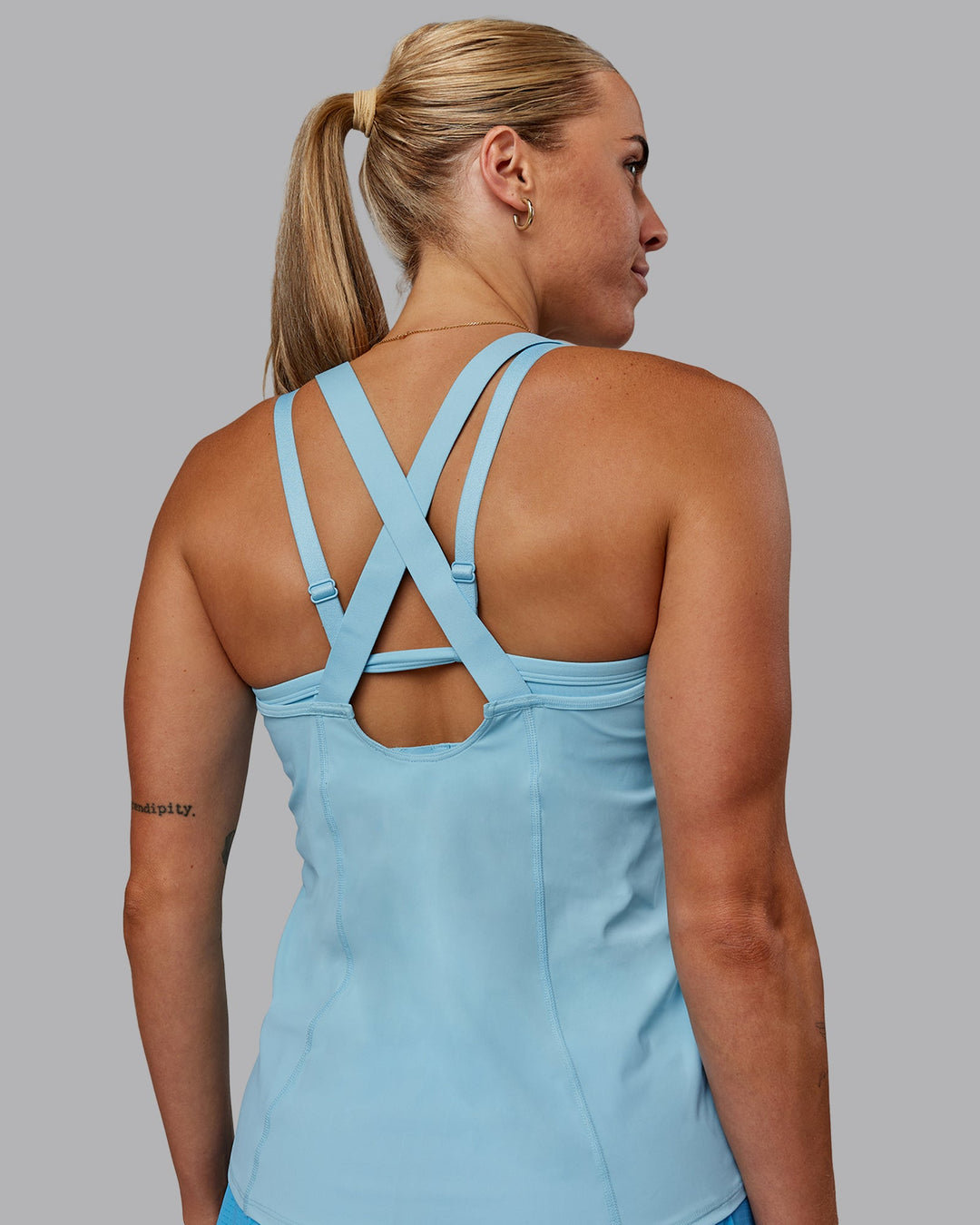 Woman wearing Rush Performance Tank - Sky Blue