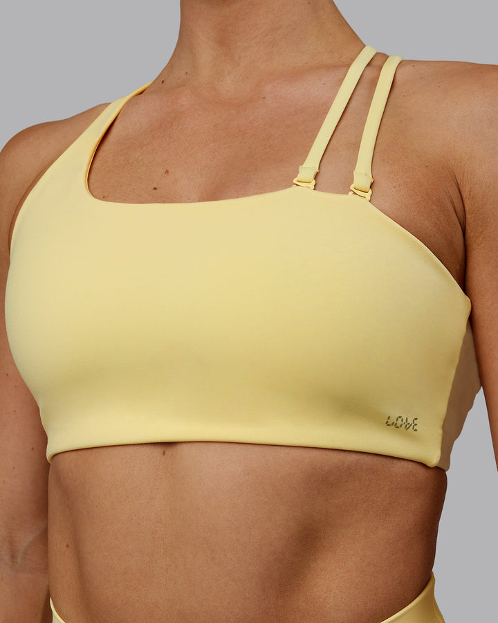 Woman wearing Sara Helios Sports Bra - Sunflower
