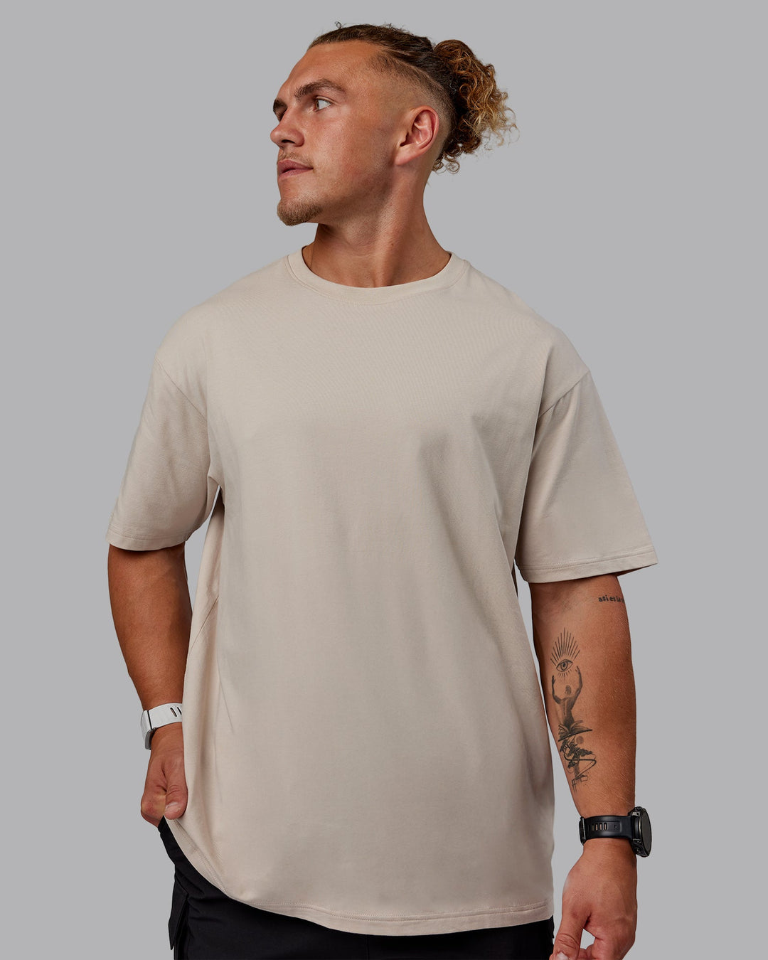 Man wearing Sara I Can Shall &amp; Will FLXCotton Tee Oversize - Shale Beige-White