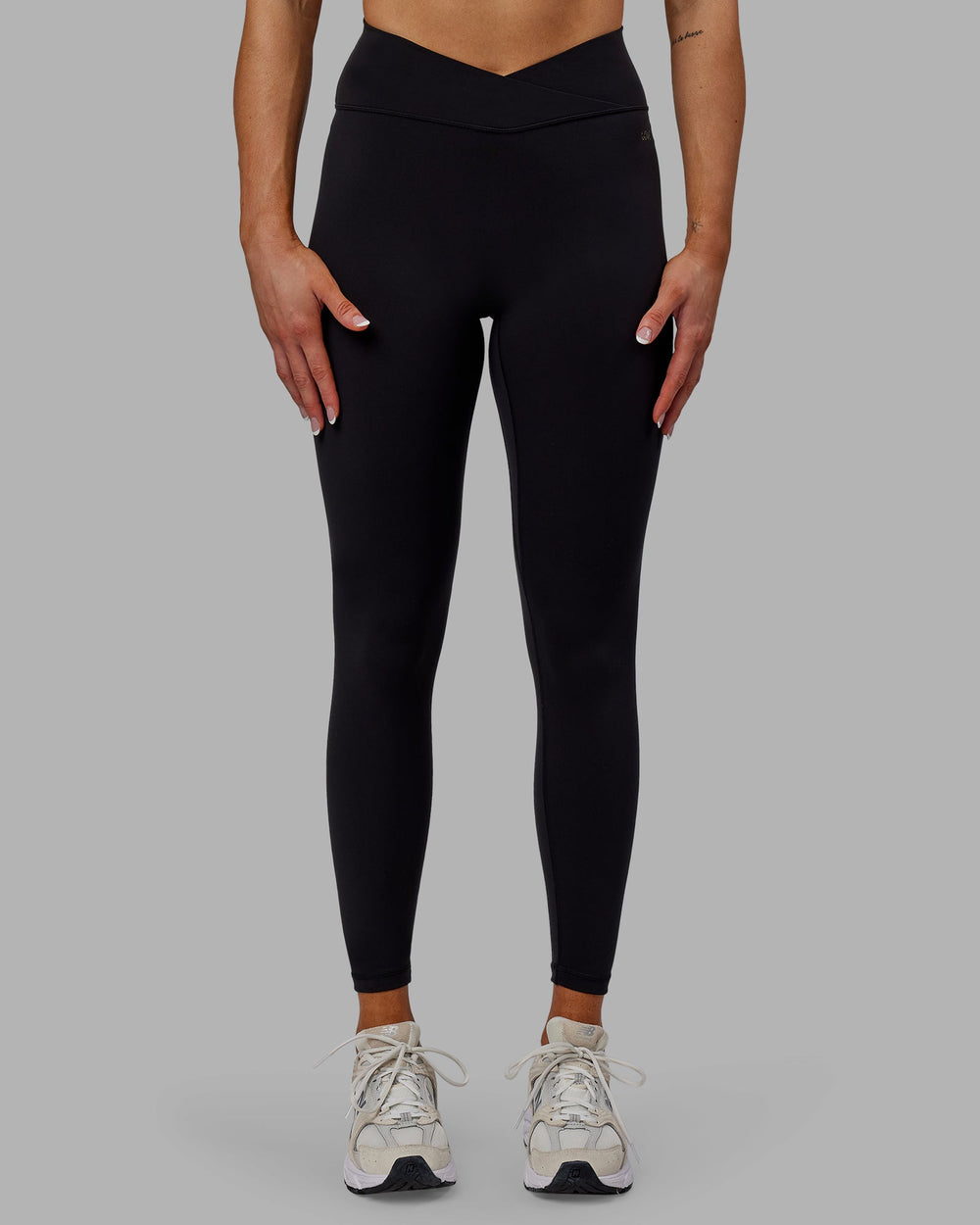 Woman wearing Sara Strike Cross Over Waist Full Length Leggings - Black