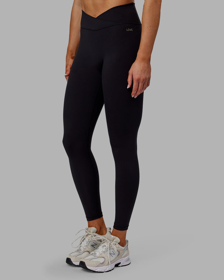 Woman wearing Sara Strike Cross Over Waist Full Length Leggings - Black
