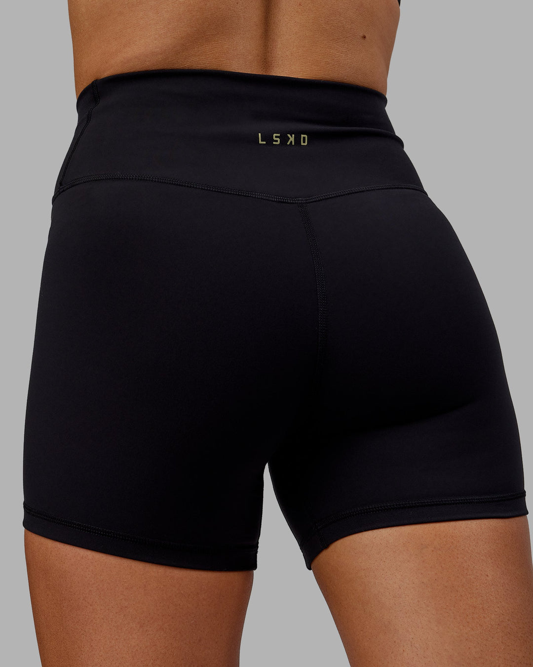 Woman wearing Sara Strike Cross Over Waist X-Length Shorts - Black