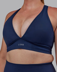 Woman wearing Stamina Sports Bra (D/DD/E) - Future Navy | Model:Tegan | Size:M