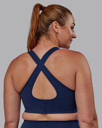 Woman wearing Stamina Sports Bra (D/DD/E) - Future Navy | Model:Tegan | Size:M