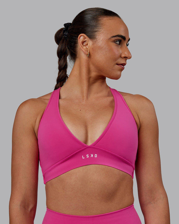 Woman wearing Stamina Sports Bra - Fuchsia Pink
