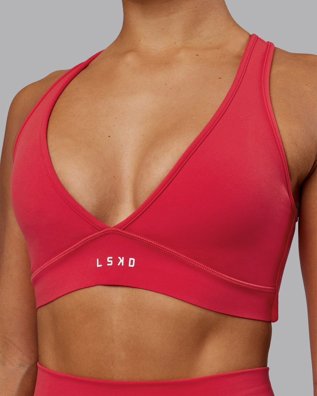 Woman wearing Stamina Sports Bra - Scarlet