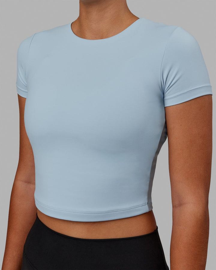 Woman wearing Staple Cropped Tee - Glacial Blue
