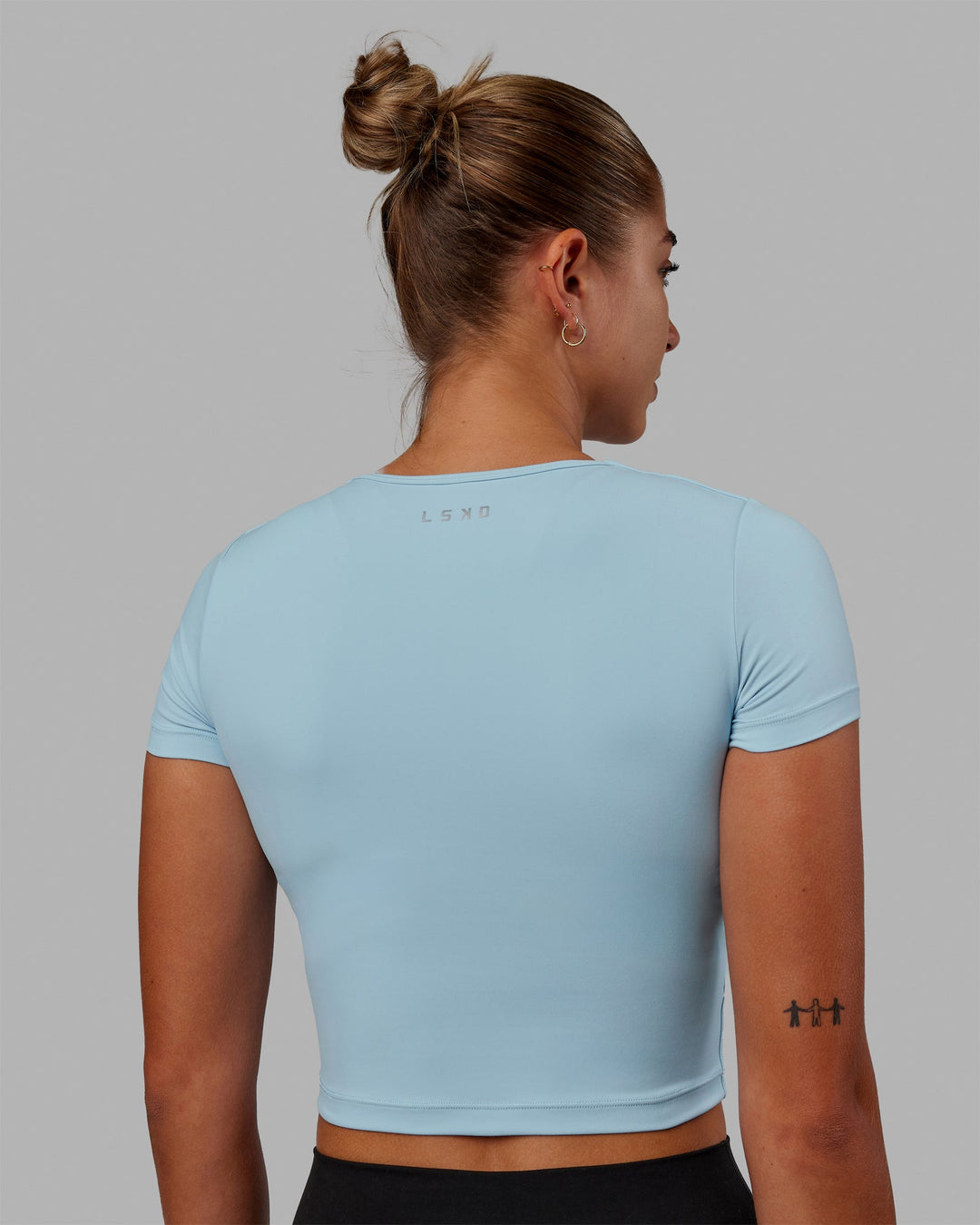 Woman wearing Staple Cropped Tee - Glacial Blue