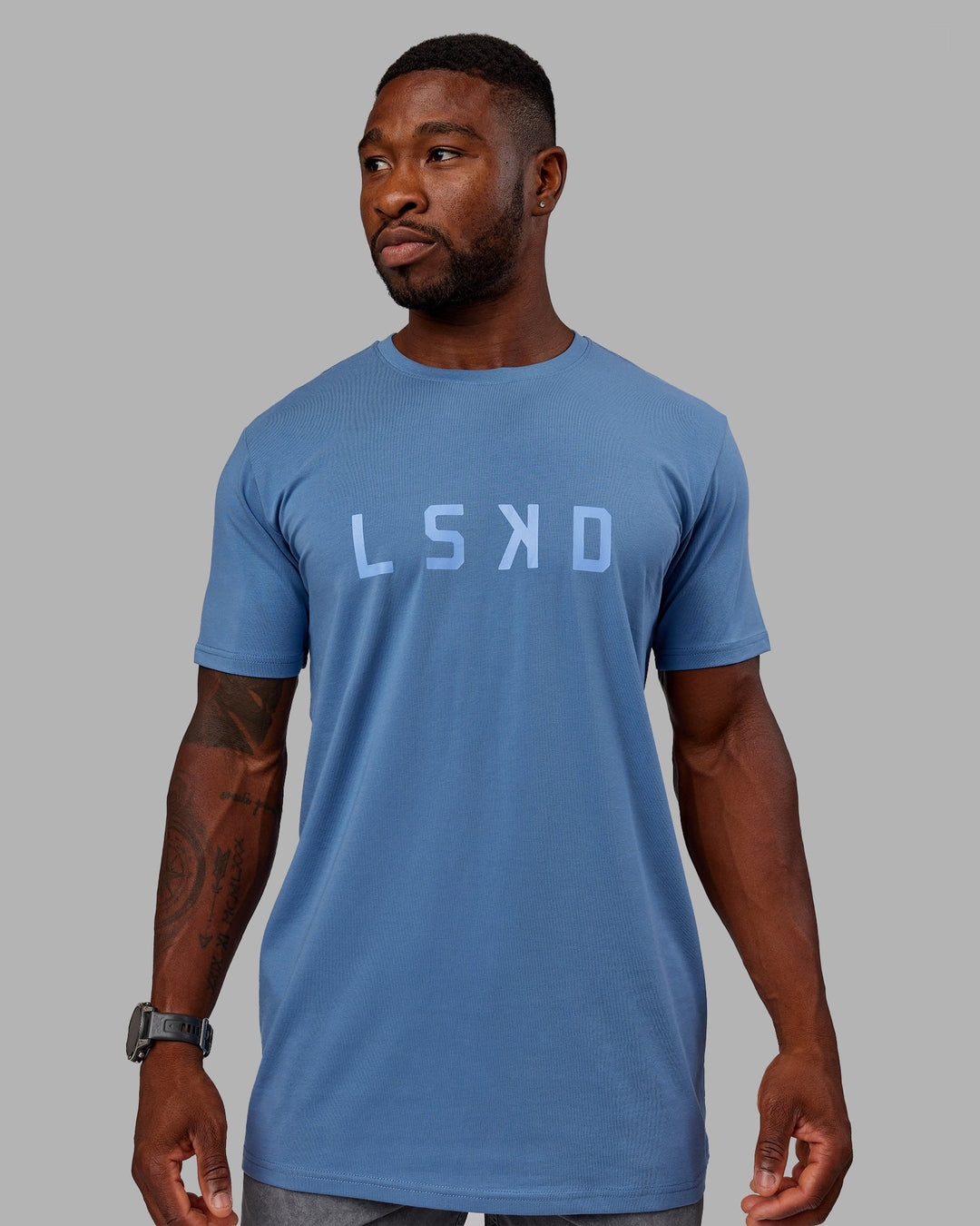 Man wearing Structure FLXCotton Tee - Elemental Blue-Arctic Blue