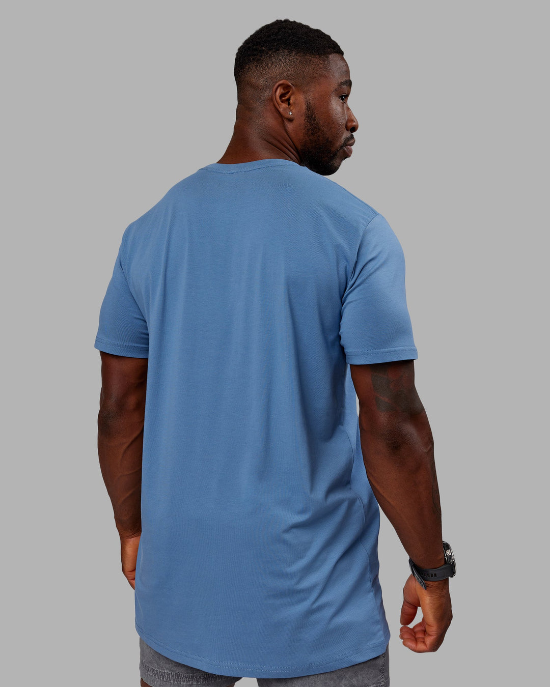 Man wearing Structure FLXCotton Tee - Elemental Blue-Arctic Blue