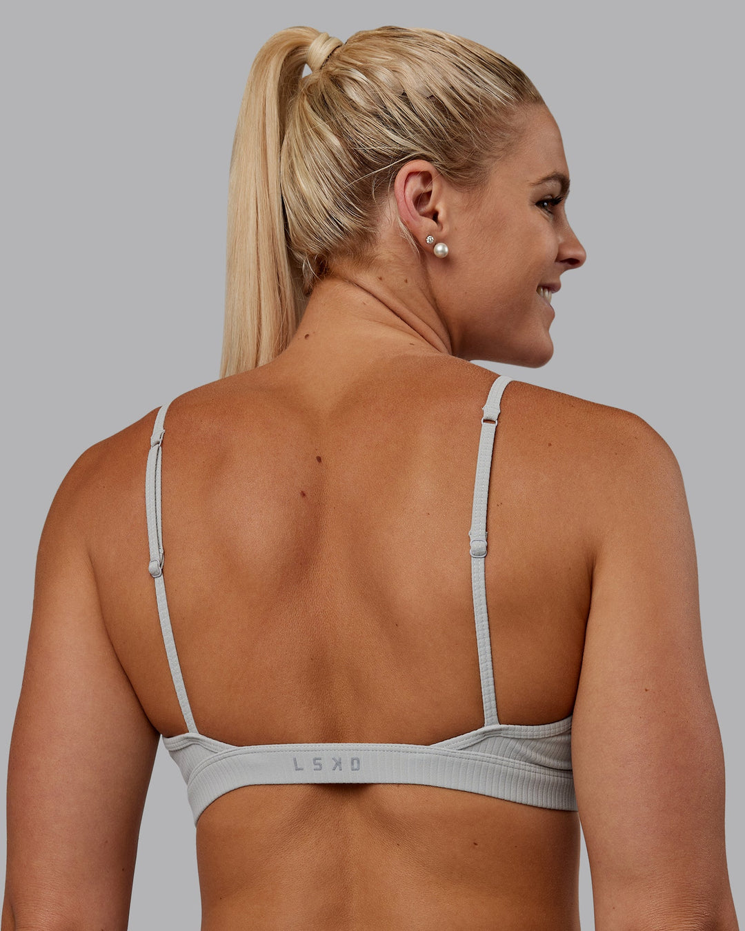 Woman wearing Tenacity Ribbed Lounge Bra - Light Grey Marl