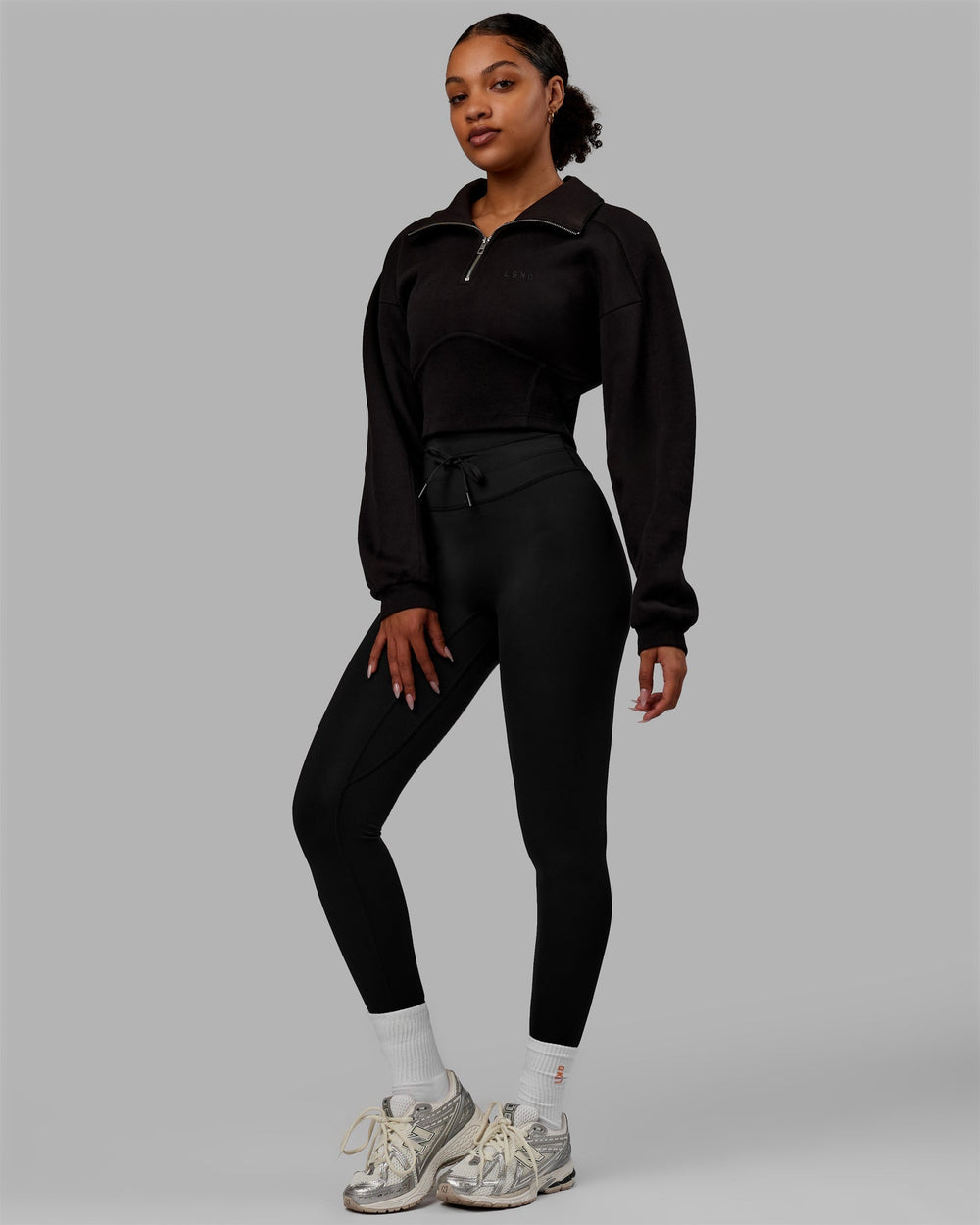 Woman wearing Thrive Corset 1/4 Zip Sweater - Black