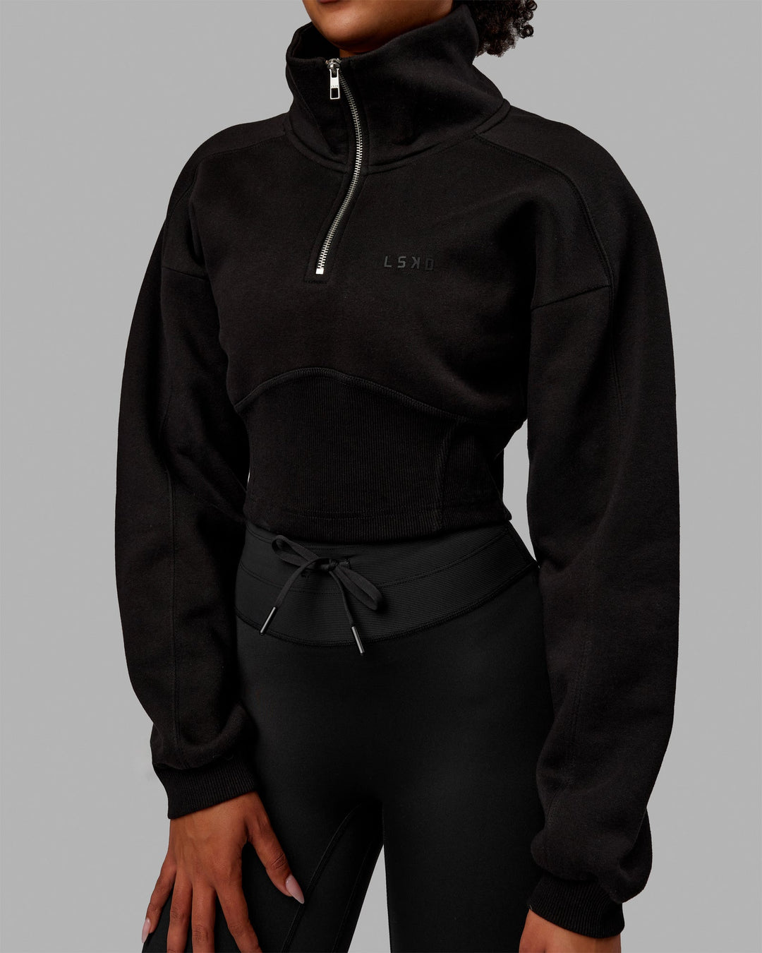 Woman wearing Thrive Corset 1/4 Zip Sweater - Black