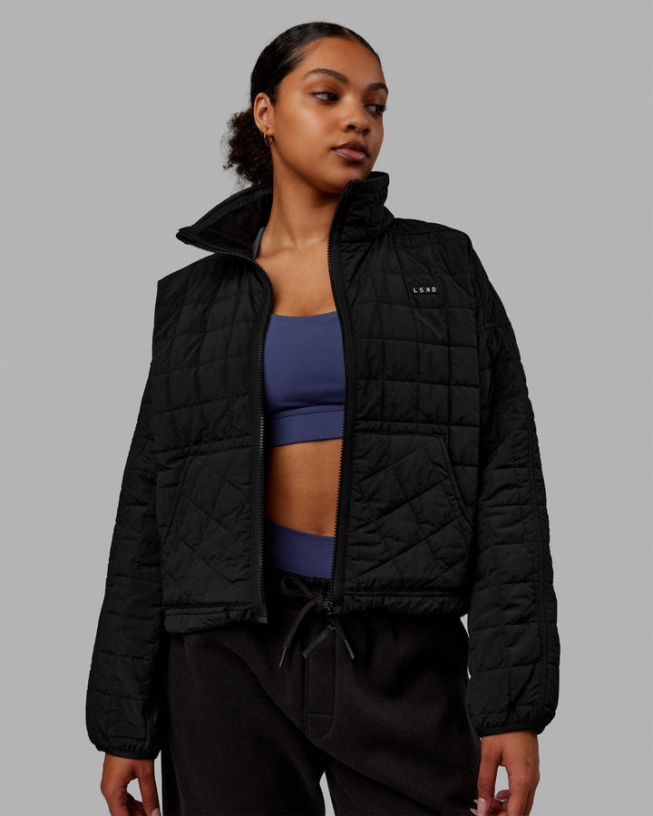 Woman wearing Thrive Packable Jacket - Black