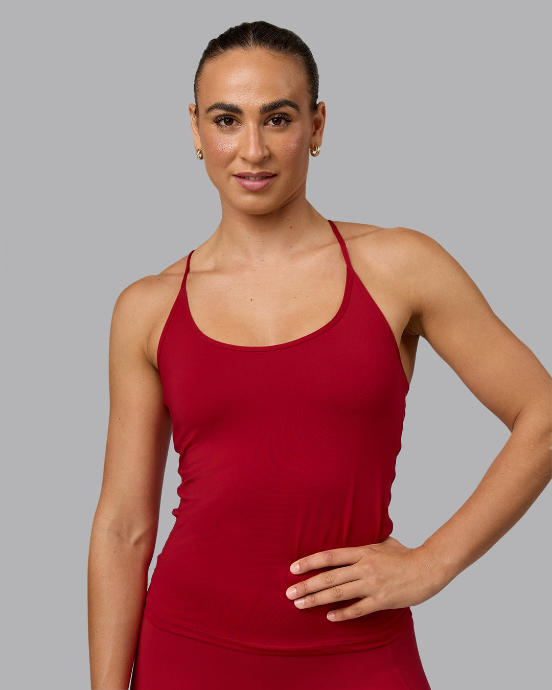 Woman wearing Transition CloudFLX Shelf Bra Tank - Cherry Red