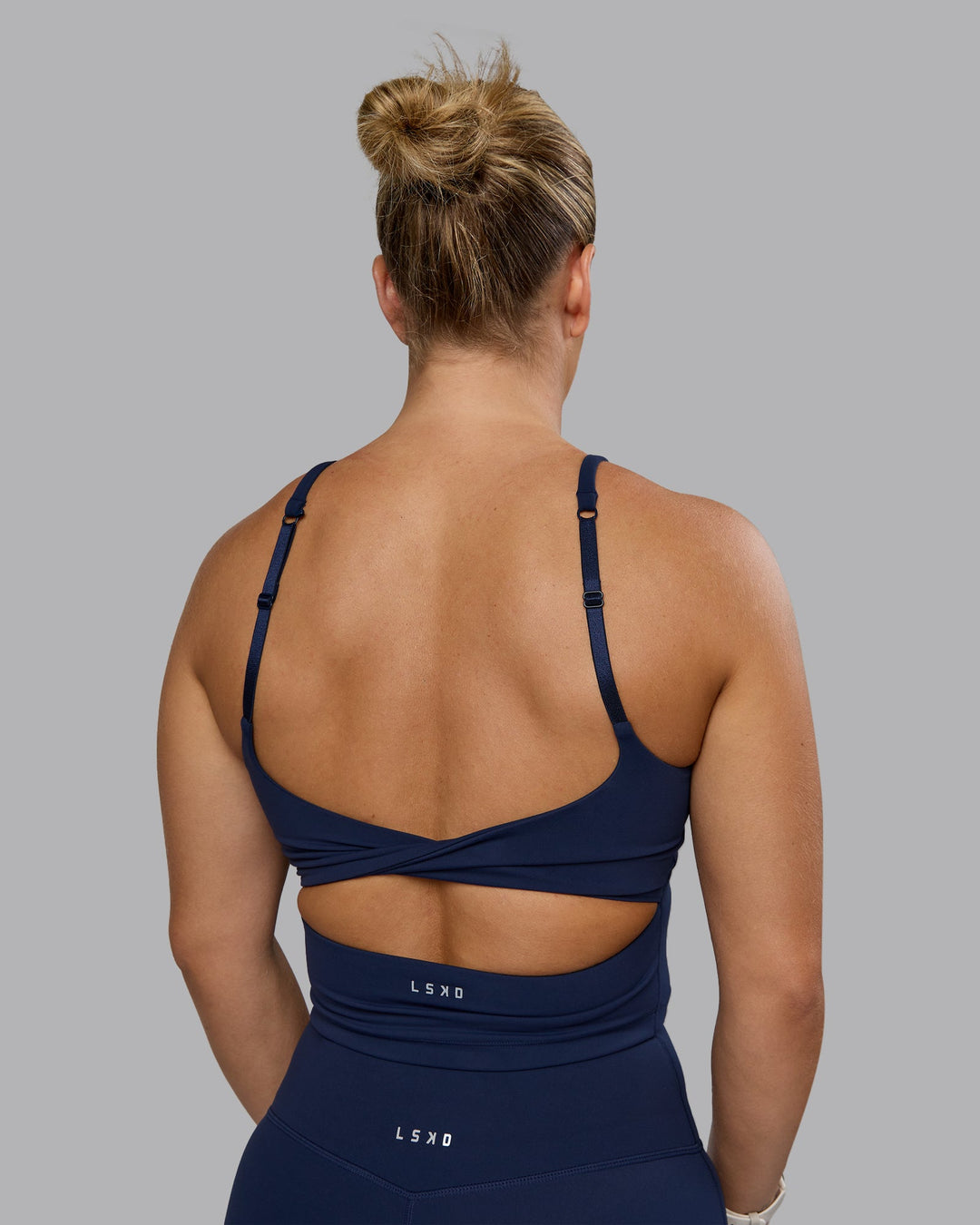 Woman wearing Twist Shelf Bra Tank - Future Navy