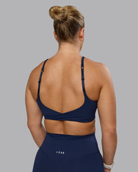 Woman wearing Twist Sports Bra - Future Navy | Model:Lyss | Size:S