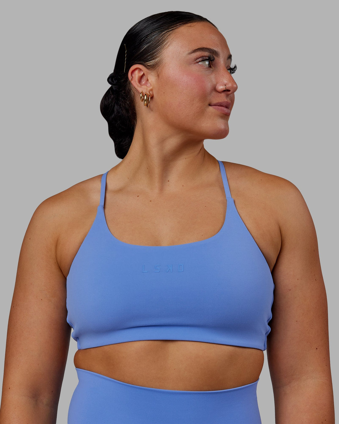 Woman wearing Twist Sports Bra - Ultramarine