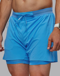 Man wearing UltraAir 5" Lined Performance Shorts - Azure Blue