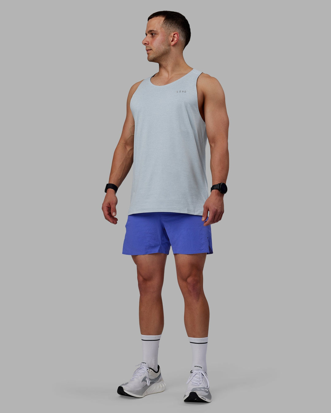 Man wearing UltraAir 5&quot; Lined Performance Shorts - Baja Blue-Reflective