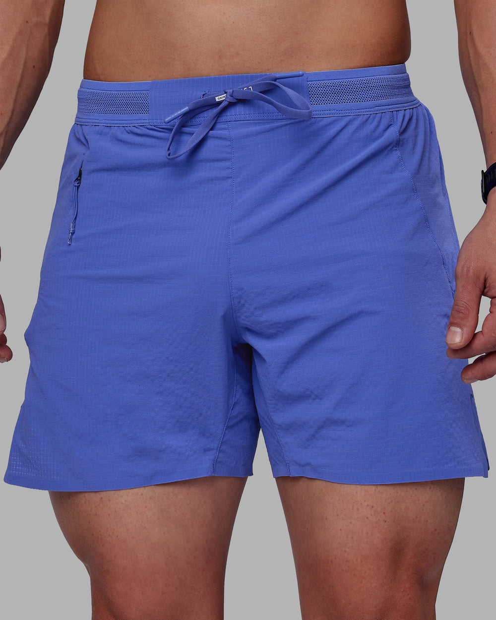 Man wearing UltraAir 5" Lined Performance Shorts - Baja Blue-Reflective