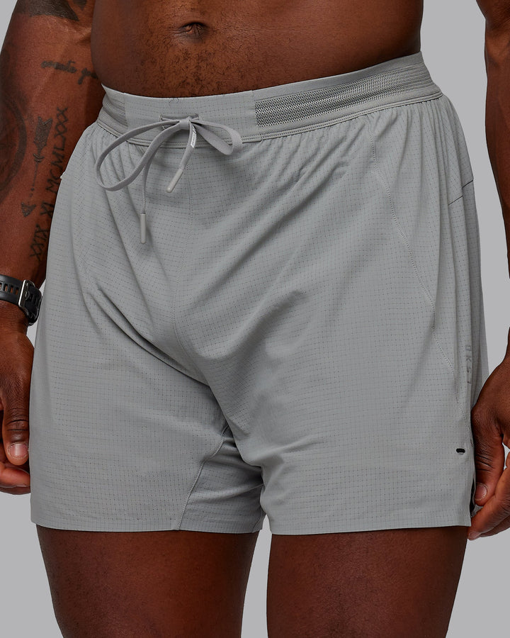 Man wearing UltraAir 5&quot; Lined Performance Shorts - Circular Grey
