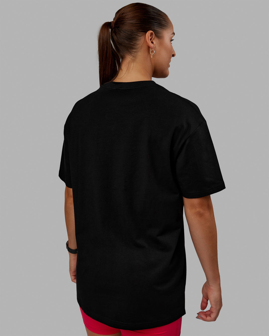 Woman wearing Unisex 1% Better FLXCotton Tee Oversize - Black-Scarlet