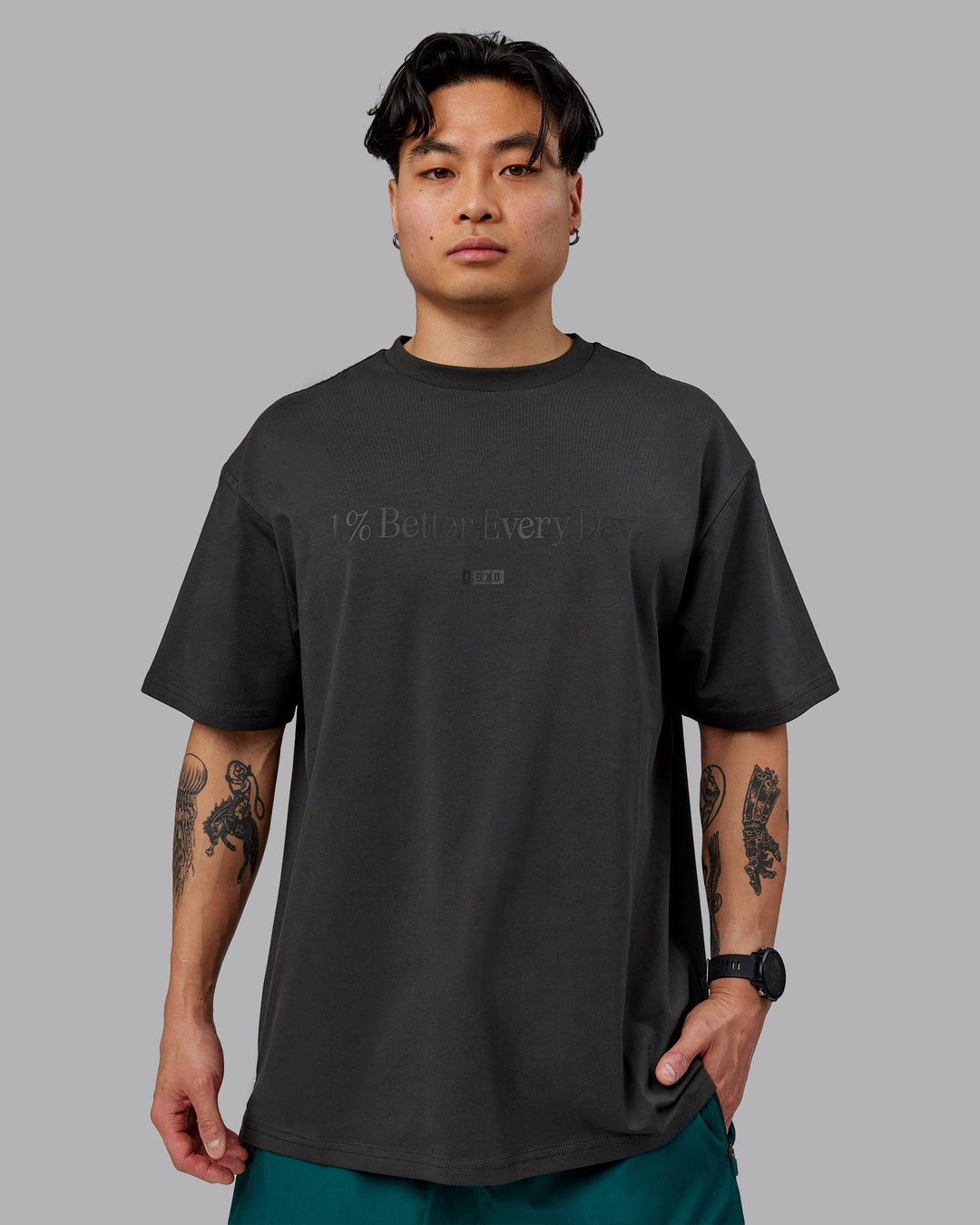 Man wearing Unisex 1% Better FLXCotton Tee Oversize - Pirate Black-Black