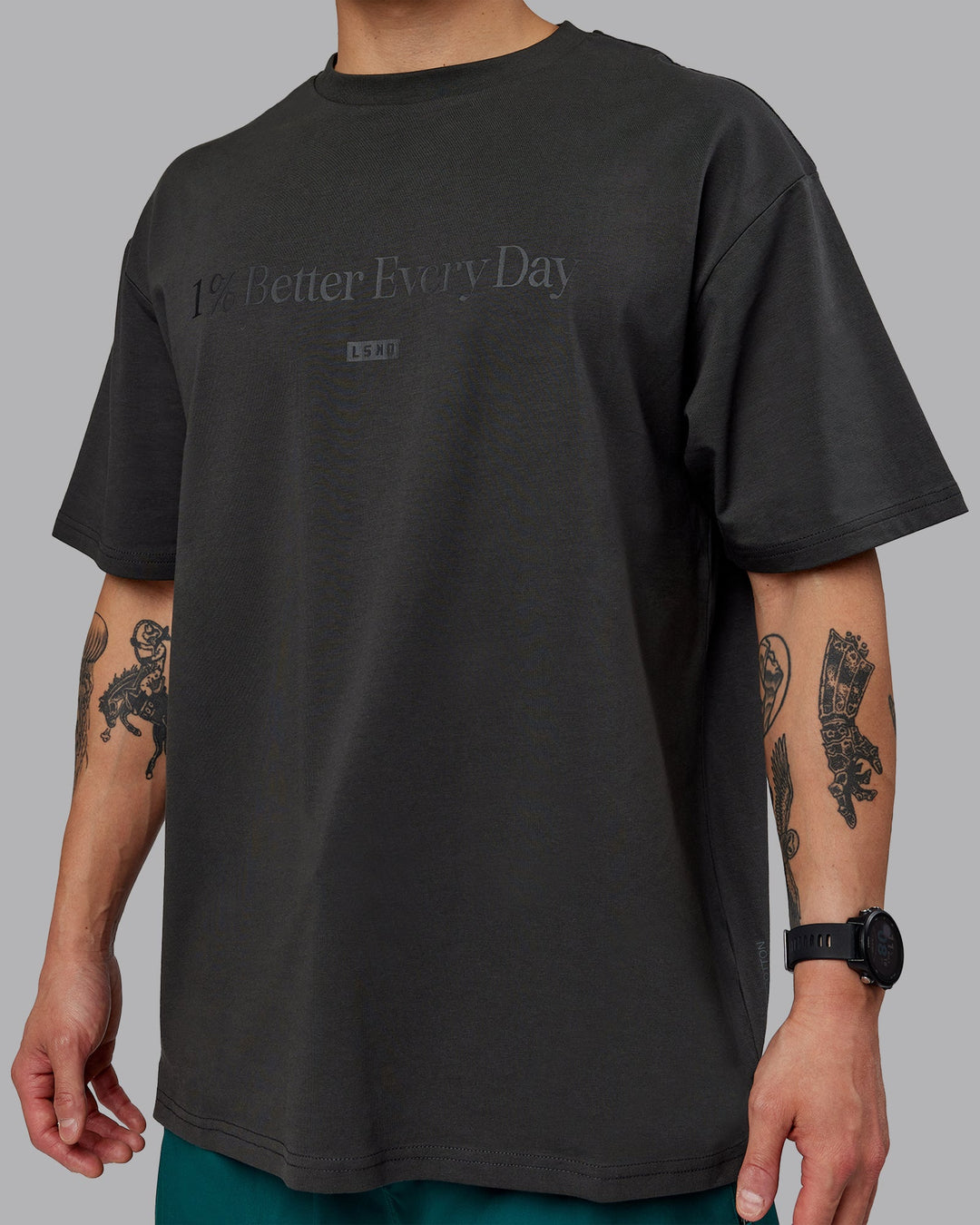 Man wearing Unisex 1% Better FLXCotton Tee Oversize - Pirate Black-Black