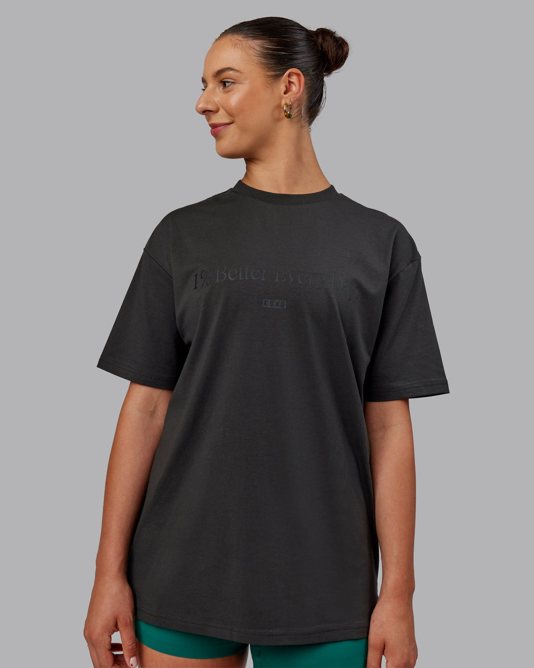 Woman wearing Unisex 1% Better FLXCotton Tee Oversize - Pirate Black-Black