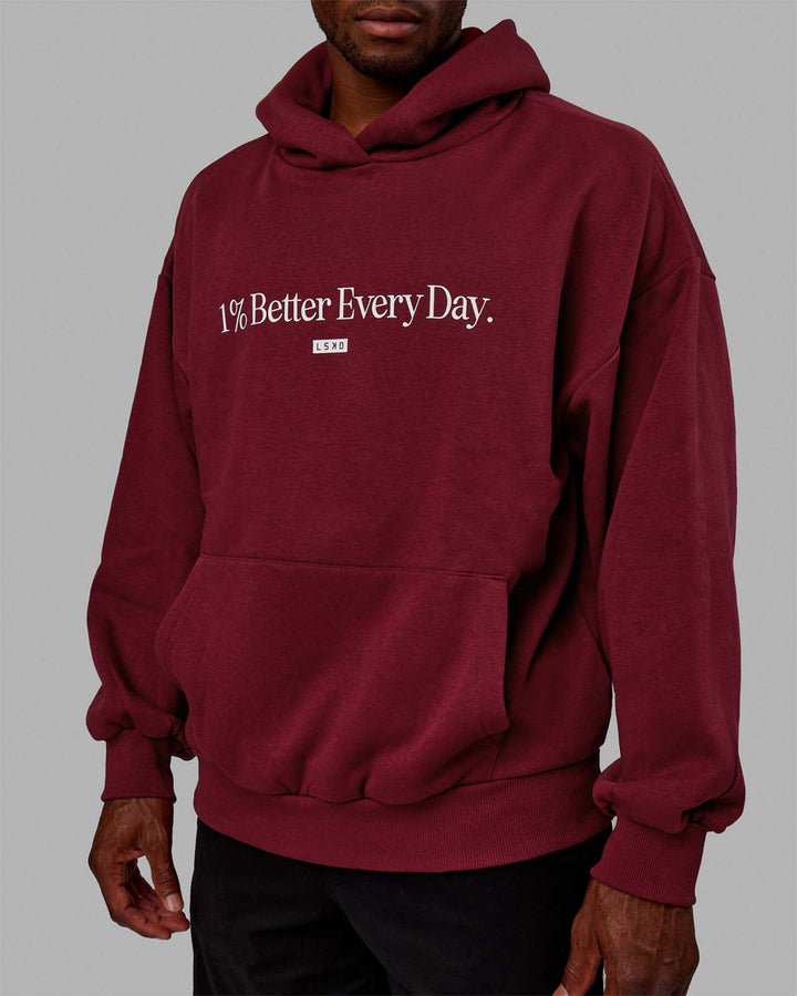 Man wearing Unisex 1% Better Hoodie Oversize - Cranberry-White