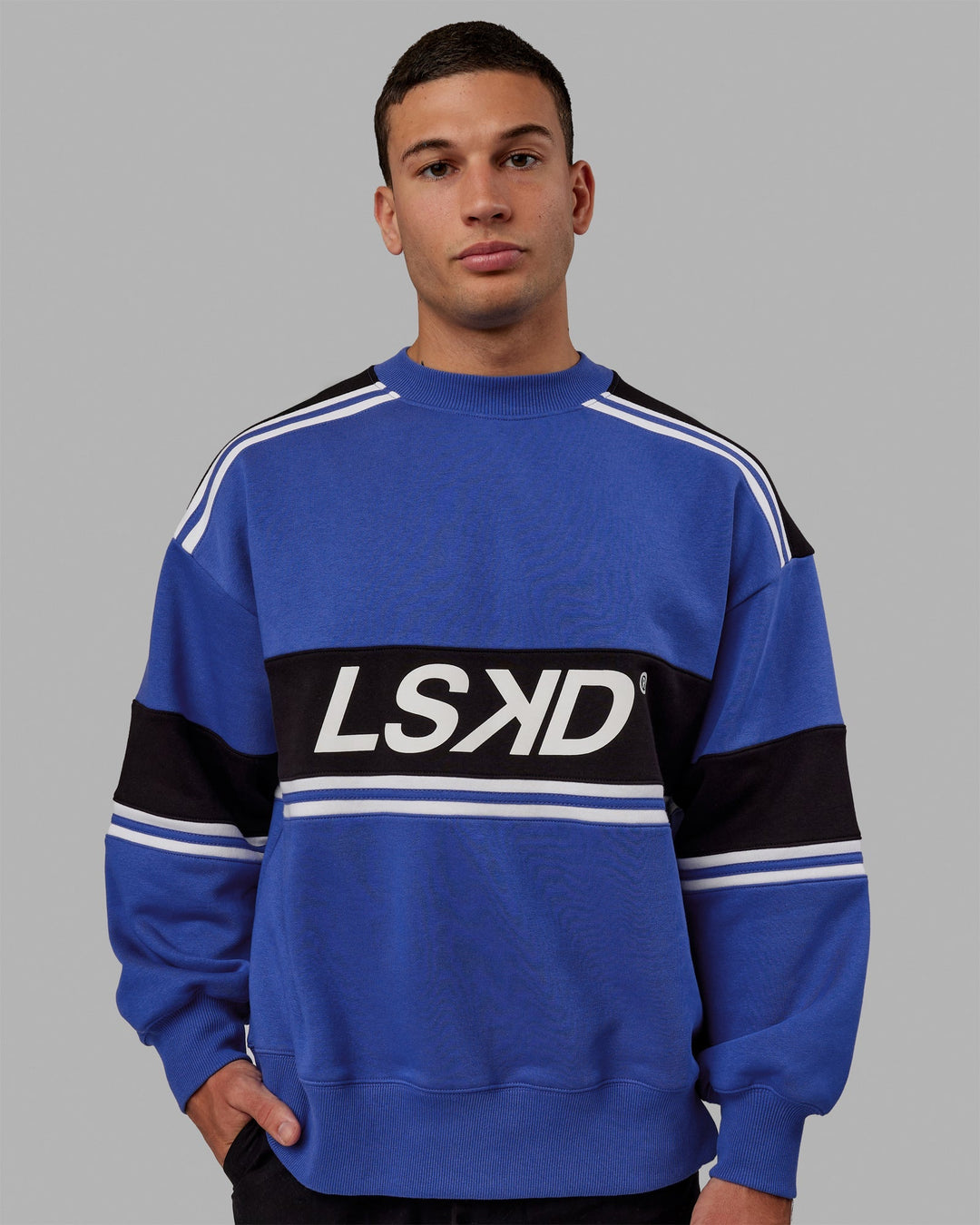Man wearing Unisex A-Team Sweater Oversize - Power Cobalt-Black
