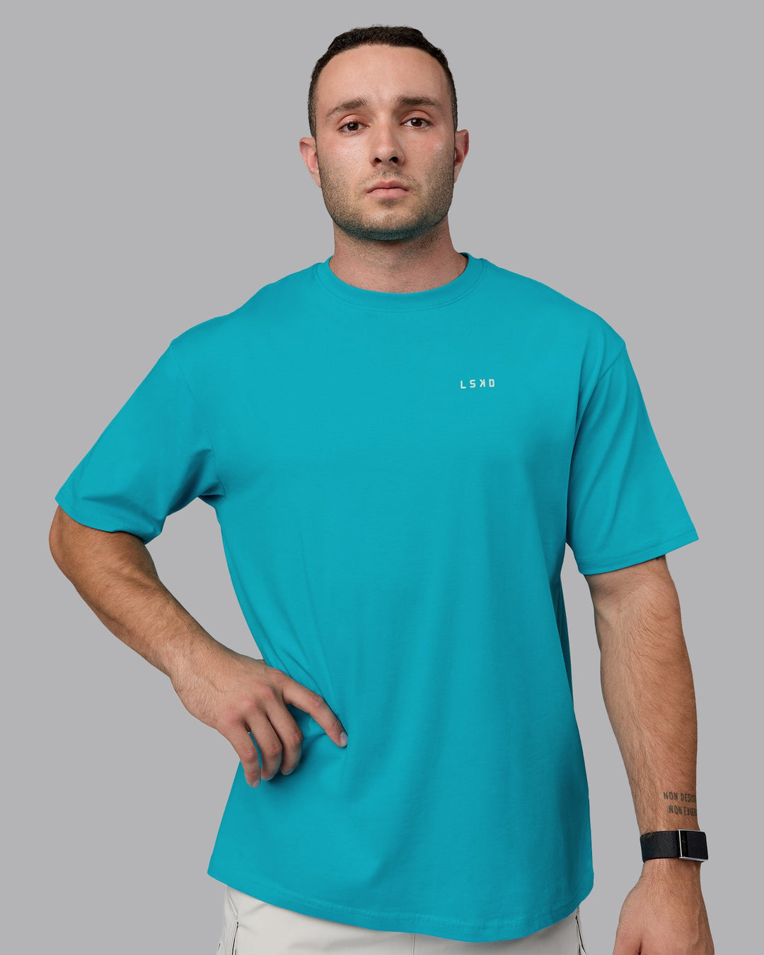 Man wearing Unisex Enjoy the Journey Value Series FLXCotton Tee Oversize - Bluebird-Surf Spray