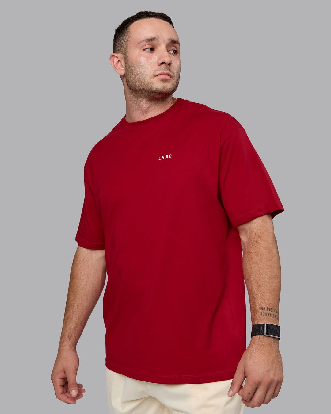 Man wearing Unisex Enjoy the Journey Value Series FLXCotton Tee Oversize - Cherry Red-Ivory