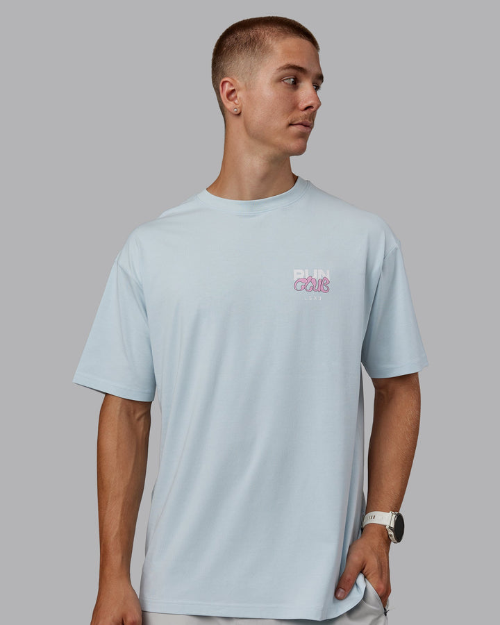 Man wearing Unisex Gone Running FLXCotton Tee Oversize - Skyride-Bubblegum
