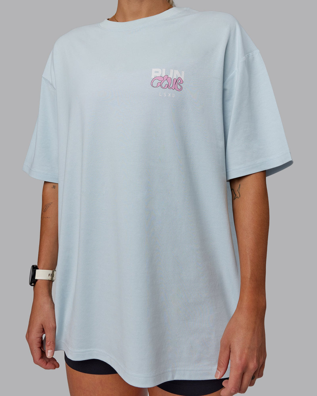 Woman wearing Unisex Gone Running FLXCotton Tee Oversize - Skyride-Bubblegum