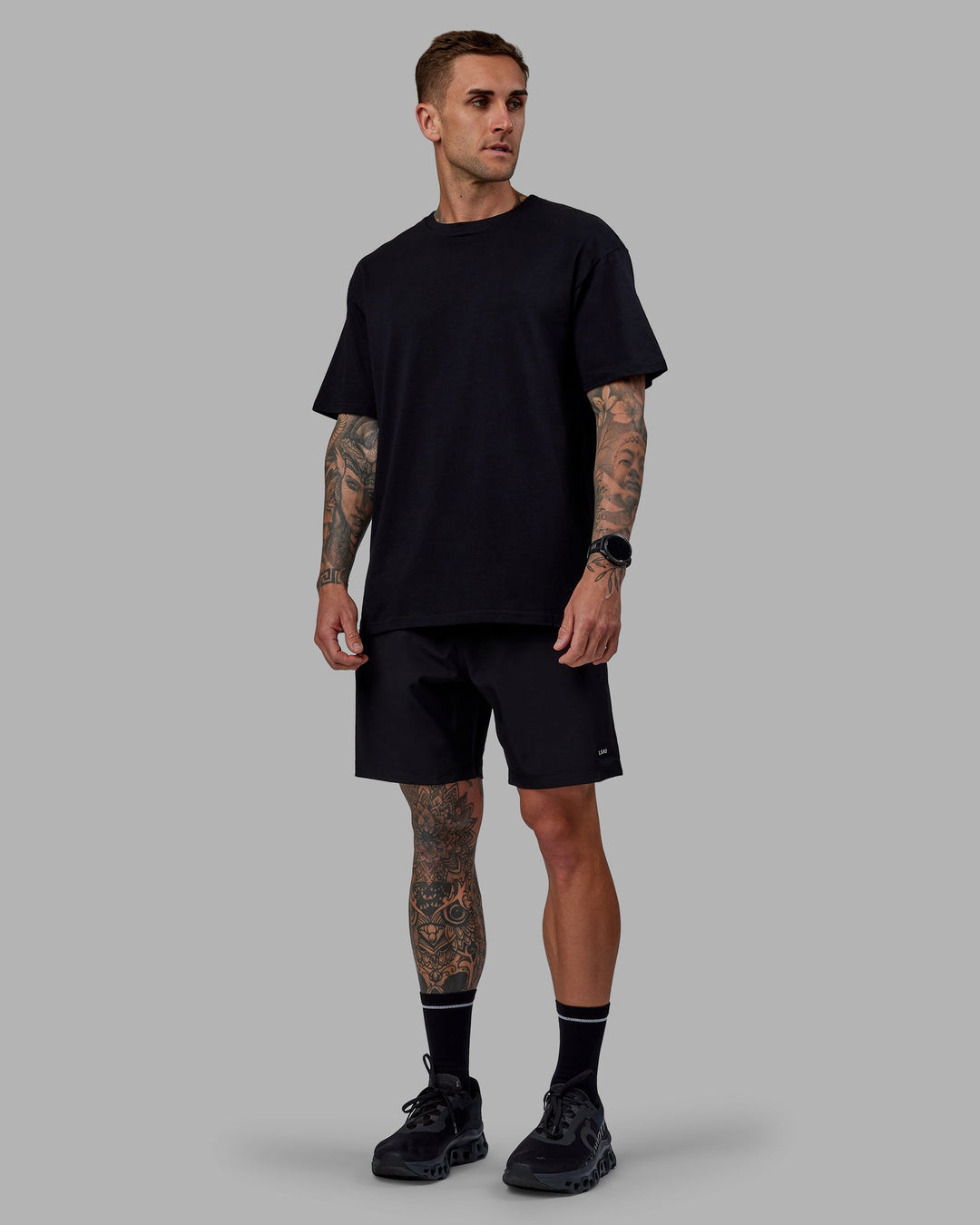 Man wearing Unisex Keep On Running FLXCotton Tee Oversize - Black-White