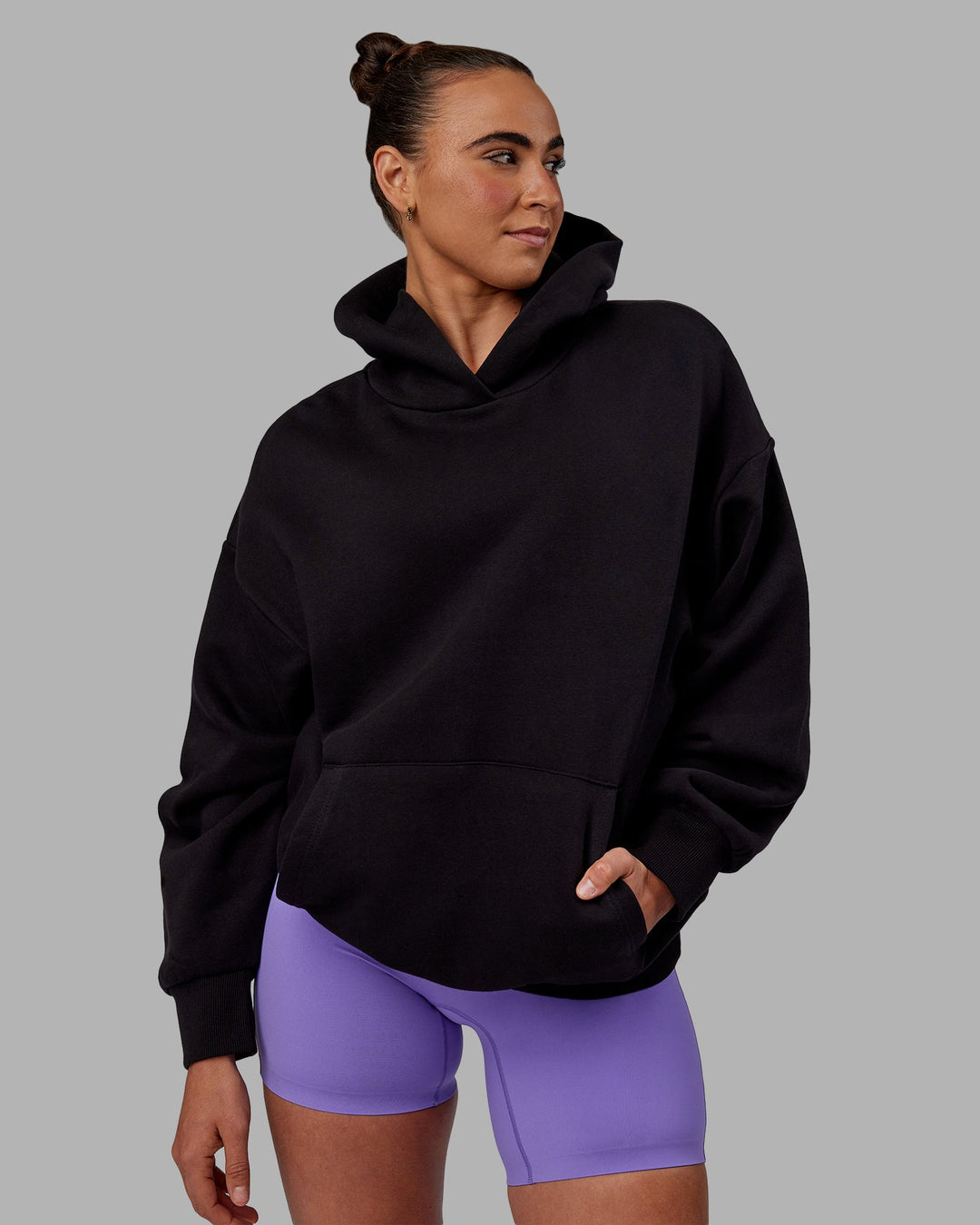 Woman wearing Unisex Keep on Running Hoodie Oversize - Black-White