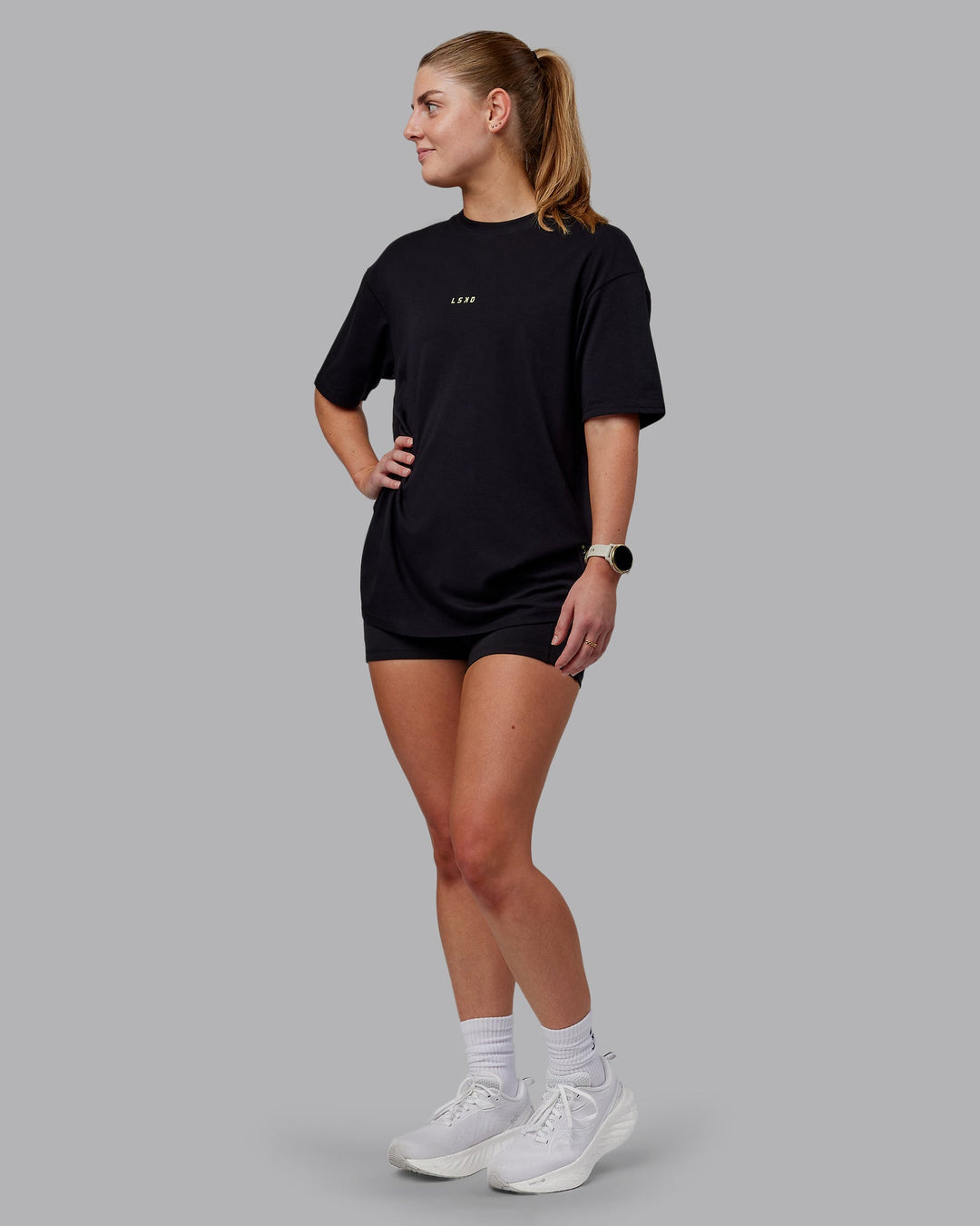 Woman wearing Unisex Leg It FLXCotton Tee Oversize - Black-Volt