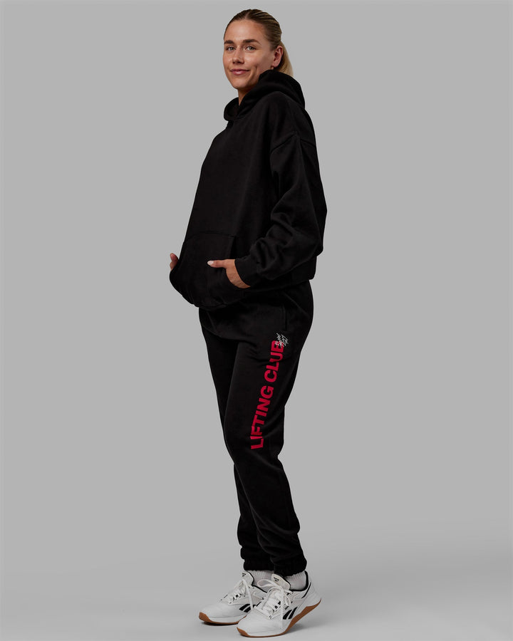 Woman wearing Unisex Lifting Club Hoodie Oversize - Black-Red