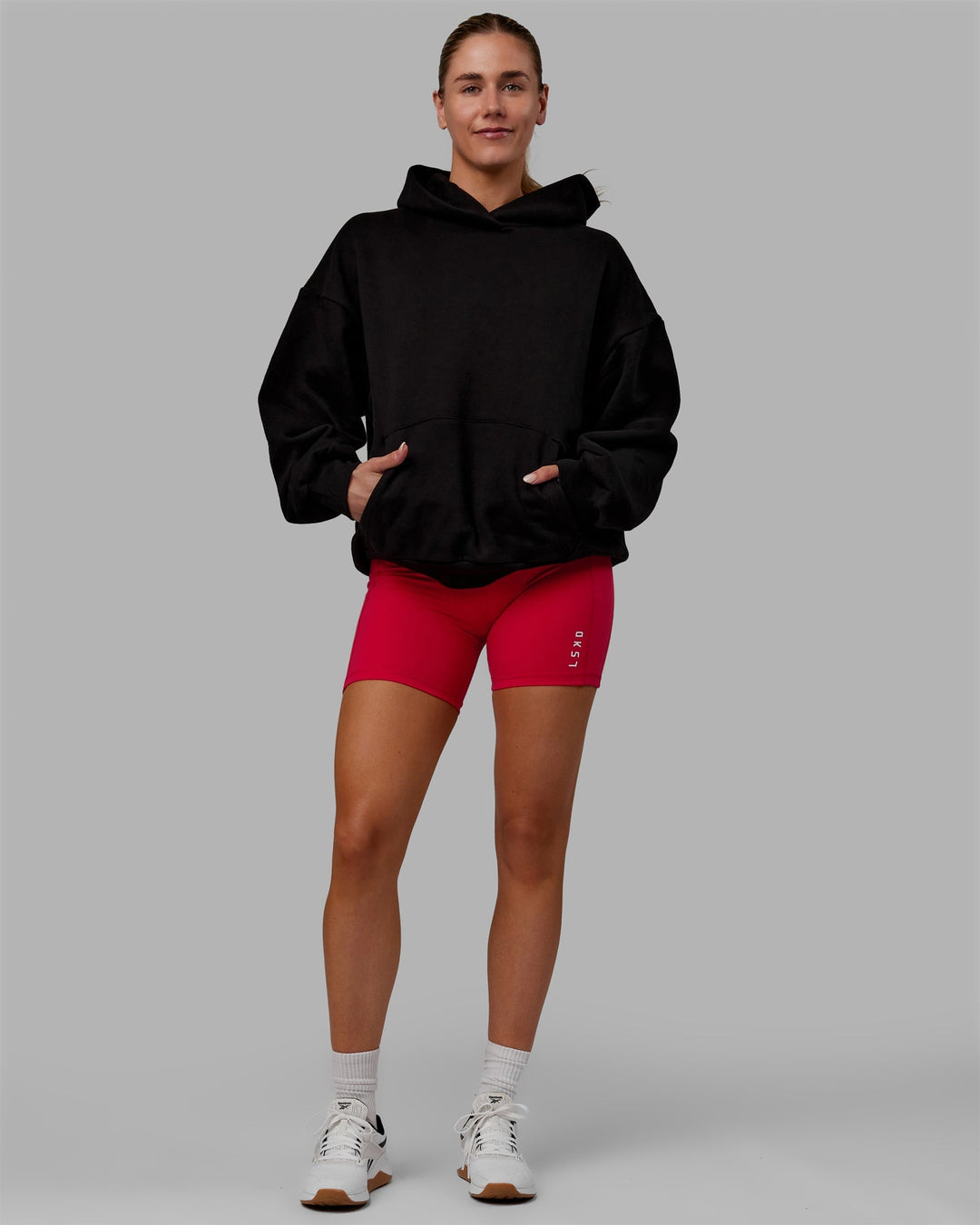 Woman wearing Unisex Lifting Club Hoodie Oversize - Black-Red