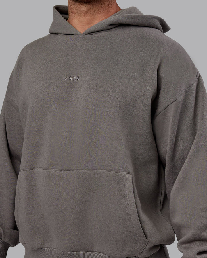 Man wearing Unisex MVP Hoodie Oversize - Storm Front
