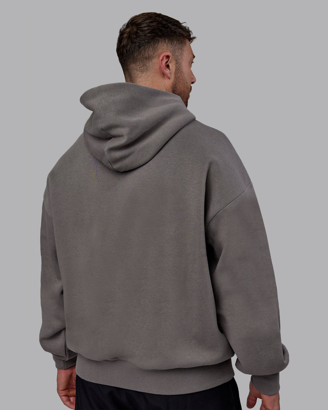 Man wearing Unisex MVP Hoodie Oversize - Storm Front